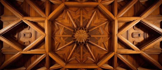 A closeup of a brown wooden ceiling with a symmetrical pattern of tints and shades, resembling artwork. The pattern consists of circles and rims, with a touch of metal detailing