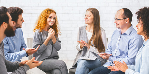 Fototapeta na wymiar People applauding to young woman at therapy session in rehab