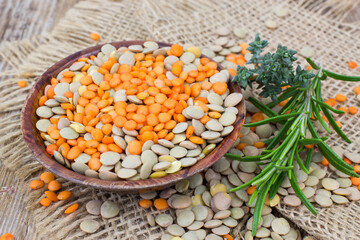lentils and fresh herbs - wooden background - 757300142