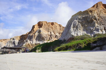 Morro Branco is a beach about 88 km from Fortaleza. The place draws attention for its dunes and, mainly, for its beautiful colored cliffs, whose sand is used to make typical regional crafts. Brazil.