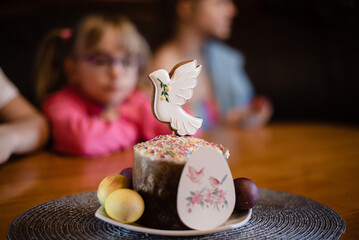 Easter bread decorated with the gingerbrad cookie in the shape of white dove.