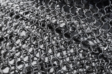 Medieval knight torso armor made of linked iron rings. Chain mail