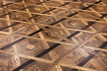 Luxury vintage parquet made of various wood types with geometric pattern