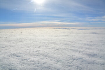Fototapeta na wymiar Carpet of clouds from above sky travel jet