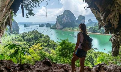 Poster Female traveler admiring the breathtaking scenery of Phang Nga Bay, a popular tourist destination in Phuket © AlfaSmart