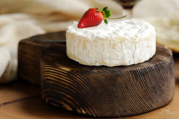 brie camembert cheese on a wooden board