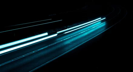 Photo sur Plexiglas Autoroute dans la nuit blue car lights at night. long exposure