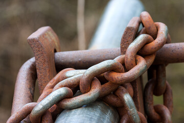 A symbol of demarcation and control. A locked barrier, secured with a strong chain.