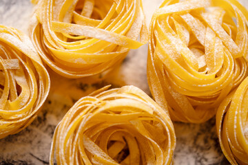 Fettuccini top view. Homemade pasta on a wooden background. Italian style cuisine Restaurant