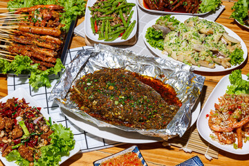 Mala restaurant food. grill fish with herbs, Spicy Century Egg Salad, Grilled Chives, choy soup, Spicy Braised Chicken Feet, mala style. China popular dish