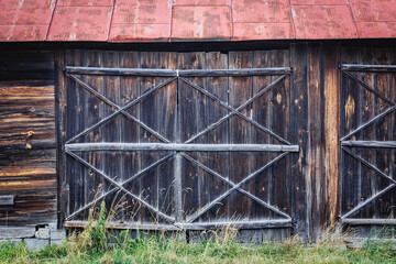 Gate of old wooden traditional barn in Wgreouw County, rural area of Mazowsze region, Poland