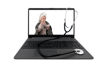 Laptop and medical stethoscope on a transparent background. On the laptop screen - a girl with cold symptoms injects a spray into her nose