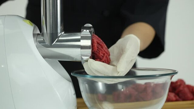 white meat mincer in operation close up footage