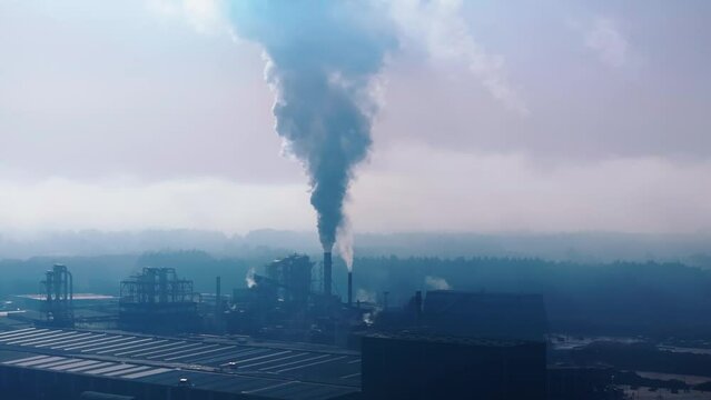 Shot of smoke emissions from an industrial factory, depicting air pollution.