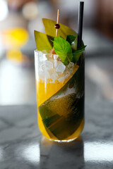 Tropical cocktail with ice and straw.