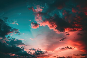 Naklejka premium Dramatic sunset sky with vibrant colors, scattered clouds, and last rays of sunlight. A tranquil and awe-inspiring nature background capturing the beauty of the sky