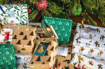 Christmas presents piled under the tree