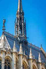 Spire of Sainte-Chapelle church on sunny day in Paris, France