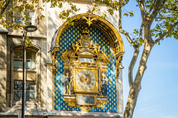 Golden clock of the Tour de l'Horloge, a clock tower in Paris, France