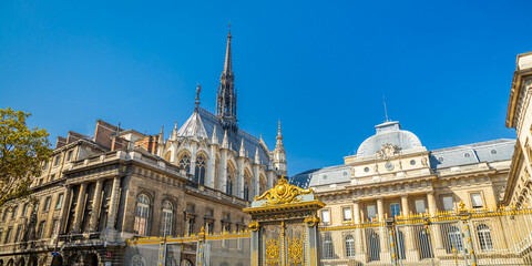 Exterior view of Paris courthouse and Sainte-Chapelle church on sunny day