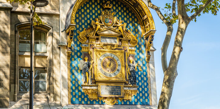 Golden clock of the Tour de l'Horloge, a clock tower in Paris, France