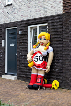 Traditional Dutch Sarah doll in front of the door of a house where a woman has turned 50.