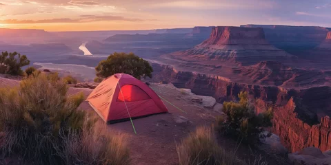 Poster Camping at Sunset with Majestic Canyon Views and Serene River, banner with copy space © zakiroff