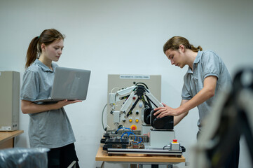 Trainee Robotics engineer learning with Programming and Manipulating Robot Hand