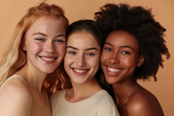 Portrait of happy diverse multi ethnic young women on beige background.