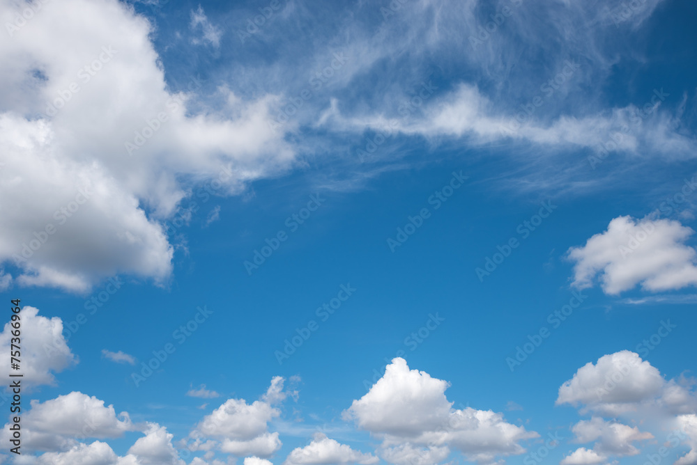 Canvas Prints blue sky background framed with cumulus and cirrus clouds.