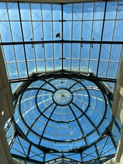 Abstract glass ceiling against a blue sky - 757368575
