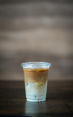 Glass of iced coffee in coffee shop, copy space and isolate concept.