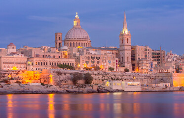 St John's Cathedral on the Valletta waterfront at sunset.