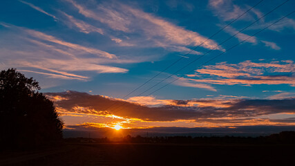 Summer sunset with reflections near Aholming, Deggendorf, Bavaria, Germany