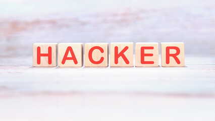 Hacker word on wooden cubes on a light background