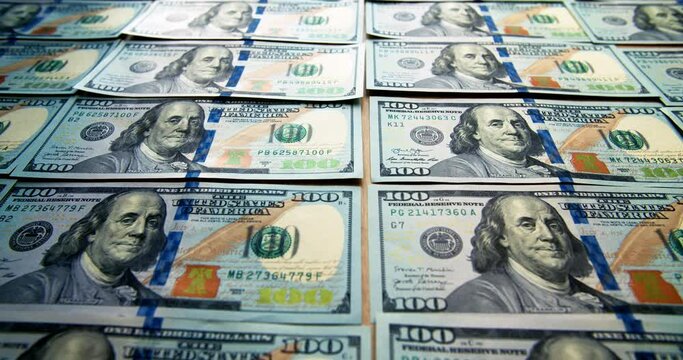 Lined up American dollar bills. The camera pans over the money. Business and finance. Crimes in the financial sector. Turnover of cash. Dirty money. sponsorship of terrorism.