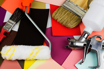 Paint spray gun at work at the workplace in the workshop. Paint Brush