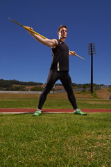Man, athlete and javelin or sport exercise for competition on grass for workout fitness or outdoor,...