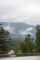 Landscape with Norwegian mountains on a foggy day.