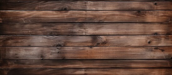 Fototapeta premium A closeup of a brown hardwood plank wall with a blurred background, showcasing the intricate pattern and building material of the wood flooring