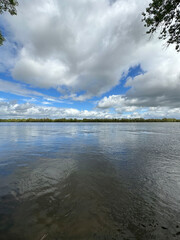 Clouds reflected at Loire river in the Loire valley in France, Europe