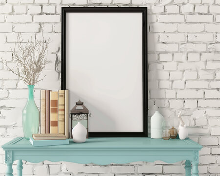 A black picture frame on an ornate blue table, books, and vases against a white brick wall background, mockup, blank poster template