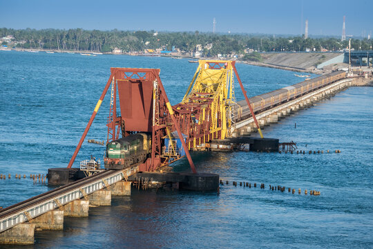 Indian Railways passenger train crossing historical , 2 kms long Pamban sea bridge.