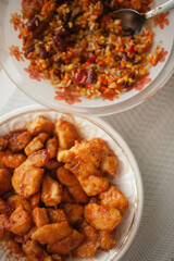 A plate filled with aromatic Chinese chicken and rice, showcasing the vibrant colors and enticing flavors of this classic dish