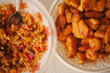 Plates adorned with delectable Chinese chicken and rice, showcasing the savory flavors and vibrant colors of Asian cuisine