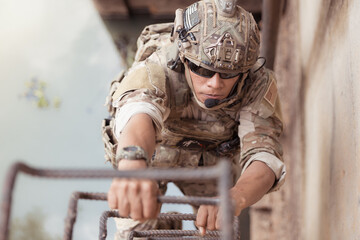 Soldiers in camouflage military uniforms carrying weapons, Reconnaissance missions in the tropical...