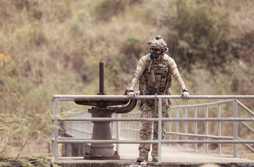 Soldiers in camouflage military uniforms carrying weapons, Reconnaissance missions in the tropical...