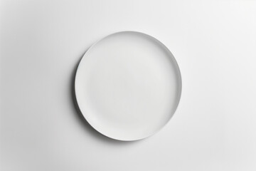 Minimalist white plate on a plain background
