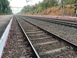 Fototapeta na wymiar A railway track or railroad track, also known as a train track or permanent way, is the structure on a railway or railroad consisting of the rails, fasteners, railroad ties and ballast. 