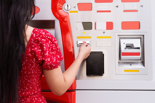 Woman using an ATM machine for financial transactions